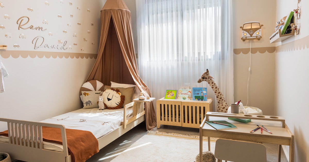 Cozy child's bedroom with bed and desk.