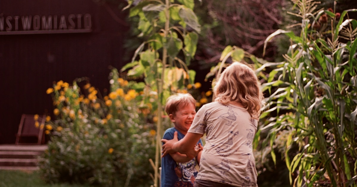 A couple of kids playing a game of baseball