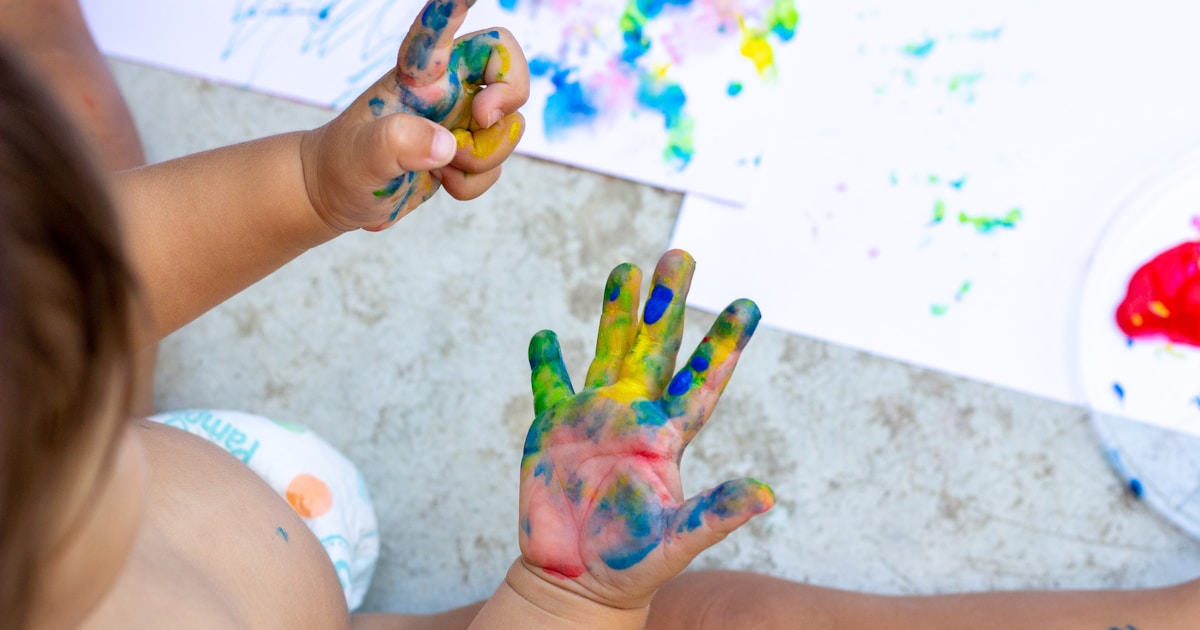 person with paint on his hands