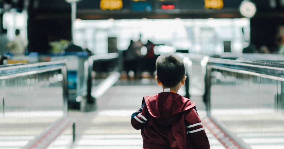 boy running in the airport